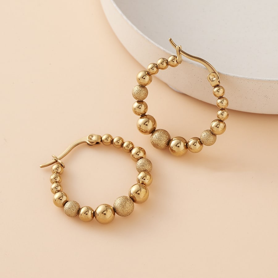 Argollas doradas con bolitas
