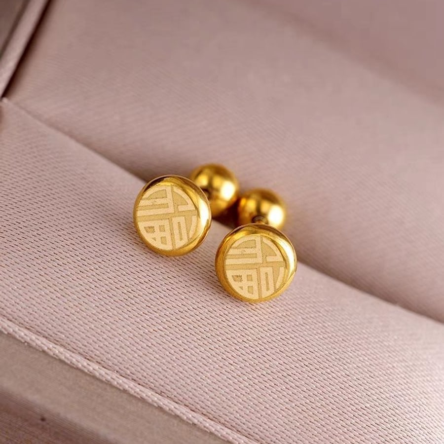 Aretes dorados redondos tipo moneda