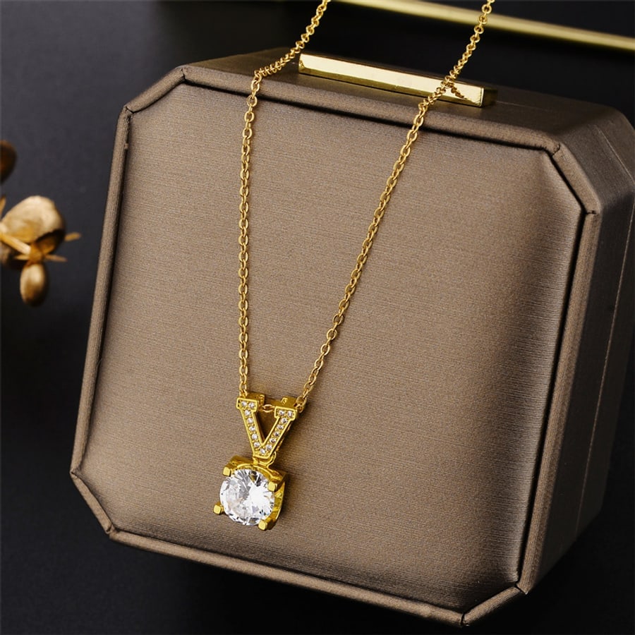 Collar dorado con dije de cristal